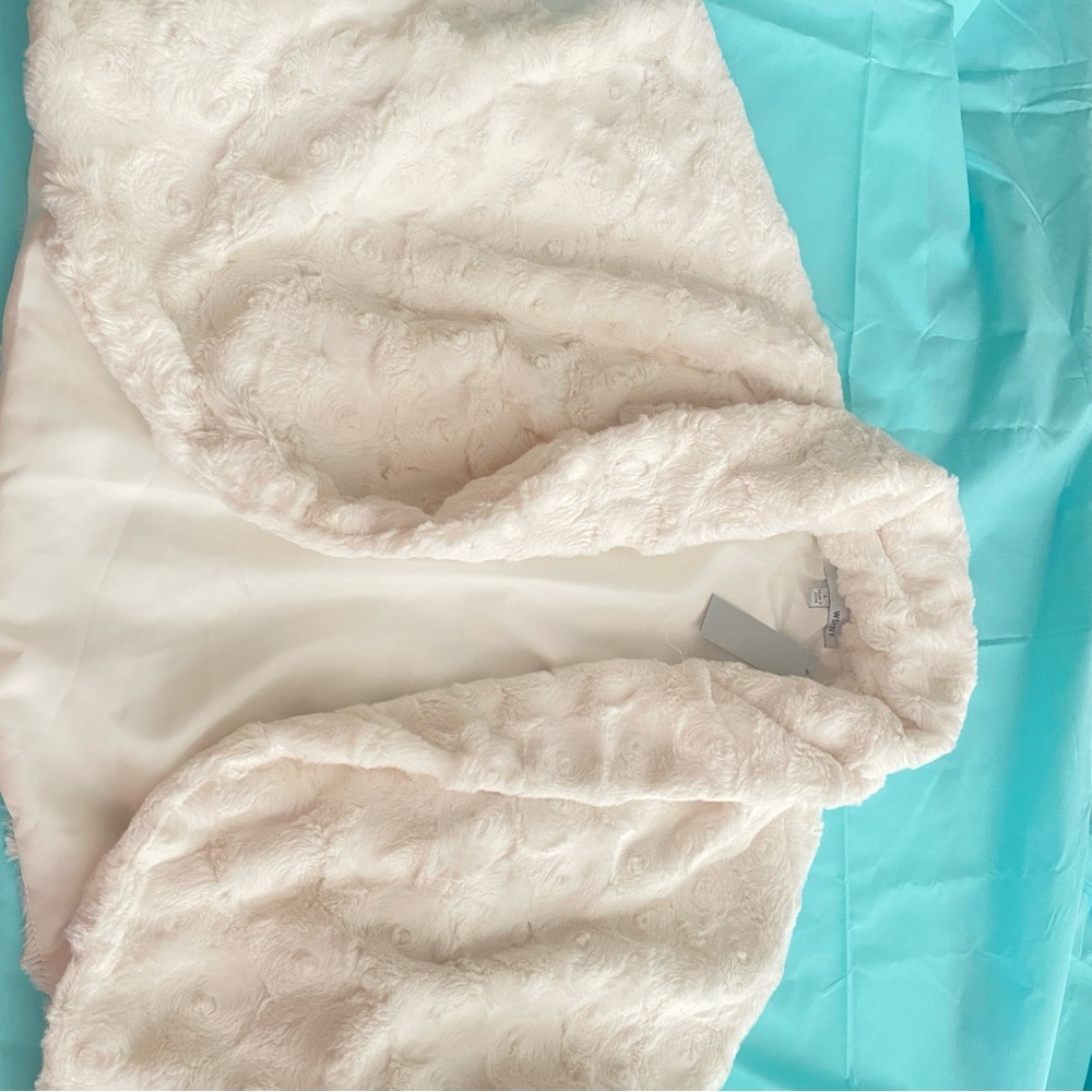 Half jacket that is cream colored